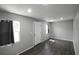 The light and bright living room is complete with wood floors, fresh paint and natural light at 5018 Pine St, Seffner, FL 33584