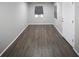 This living room features wood floors, fresh paint and natural light at 5018 Pine St, Seffner, FL 33584