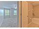 Bathroom with a shower-tub combo connected to the bedroom at 6332 Timberly Ln, Zephyrhills, FL 33542