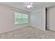 Bedroom with a closet, a window, and carpet at 6332 Timberly Ln, Zephyrhills, FL 33542