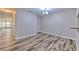 Open concept dining area with hardwood floors and views to the living area at 6332 Timberly Ln, Zephyrhills, FL 33542