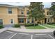 Charming townhome with lush landscaping, a welcoming entrance, and convenient parking spaces at 6332 Timberly Ln, Zephyrhills, FL 33542