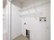 Laundry room with hookups and shelving at 6332 Timberly Ln, Zephyrhills, FL 33542