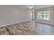Bright living room featuring modern flooring and ample natural light at 6332 Timberly Ln, Zephyrhills, FL 33542