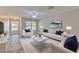 Stylish living room with chic furniture, elegant decor, and wood-look flooring throughout at 6332 Timberly Ln, Zephyrhills, FL 33542