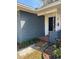 Close-up of the front entryway with a brick facade, decorative door, and simple security system at 641 Geneva Pl, Tampa, FL 33606