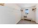 Spacious closet with ample shelving, a bench, and a window view at 6875 Broad River Ave, Land O Lakes, FL 34638