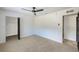 Bedroom with large closets, neutral carpet, and white walls at 8402 Roxboro Dr, Hudson, FL 34667