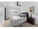 Comfortable bedroom features a bed and complementing furnishings at 8402 Roxboro Dr, Hudson, FL 34667