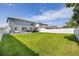 Expansive backyard with lush green lawn and privacy fence at 10270 Shady Preserve Dr, Riverview, FL 33578