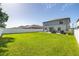 Large grassy backyard featuring a patio area and privacy fence at 10270 Shady Preserve Dr, Riverview, FL 33578