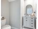 Chic half bathroom featuring a modern vanity, elegant mirror, and contemporary fixtures for a sophisticated look at 10270 Shady Preserve Dr, Riverview, FL 33578
