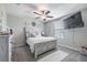 Cozy bedroom with wood accents, neutral decor, and ample natural light at 10270 Shady Preserve Dr, Riverview, FL 33578