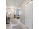 Welcoming entrance hallway featuring tiled flooring, a decorative table, and a glimpse of the front door at 10270 Shady Preserve Dr, Riverview, FL 33578