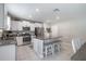 Well-appointed kitchen with stainless steel appliances, granite countertops, and an island with seating at 10270 Shady Preserve Dr, Riverview, FL 33578