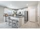 Bright kitchen with white cabinets, stainless steel appliances, and granite countertops at 10270 Shady Preserve Dr, Riverview, FL 33578