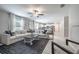 Open-concept living room with ample seating and natural light at 10270 Shady Preserve Dr, Riverview, FL 33578