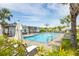 Community pool featuring lounge chairs and mature landscaping at 10270 Shady Preserve Dr, Riverview, FL 33578