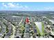Aerial view of a residential area with a lake, green spaces, and a clear sky background at 10813 Rockledge View Dr., Riverview, FL 33579