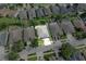 Aerial view of a well-maintained neighborhood with a landscaped yard, two-car garage, and ample parking at 10813 Rockledge View Dr., Riverview, FL 33579