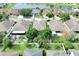 Aerial view of houses and a pond within the community, displaying the neighborhood layout at 10813 Rockledge View Dr., Riverview, FL 33579