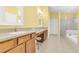 Bright bathroom features double sinks, ample countertop space, and a separate shower and tub at 10813 Rockledge View Dr., Riverview, FL 33579
