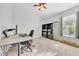 Functional bedroom featuring a desk, shelving, and comfortable carpeting at 10813 Rockledge View Dr., Riverview, FL 33579