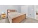Comfortable bedroom with wood bedframe, carpeted floors, and a large closet for ample storage at 10813 Rockledge View Dr., Riverview, FL 33579