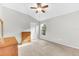Bright bedroom with natural light, vaulted ceiling, ceiling fan, and tan carpeting at 10813 Rockledge View Dr., Riverview, FL 33579