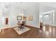 Elegant dining room featuring a round table, hardwood floors, and a stylish chandelier at 10813 Rockledge View Dr., Riverview, FL 33579