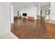 Spacious living room featuring hardwood floors, vaulted ceilings, and abundant natural light at 10813 Rockledge View Dr., Riverview, FL 33579