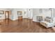 Inviting living room with hardwood floors, neutral walls, and a comfortable chair at 10813 Rockledge View Dr., Riverview, FL 33579