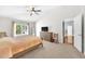 Bright and airy bedroom with a ceiling fan, neutral walls, and plush carpeting at 10813 Rockledge View Dr., Riverview, FL 33579