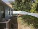 Spacious backyard with a hammock and bench, fenced for privacy and relaxation at 12216 Southbridge Ter, Hudson, FL 34669