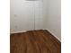 The bedroom has neutral walls, laminate flooring, and a closet at 12216 Southbridge Ter, Hudson, FL 34669
