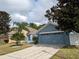 Charming single-Gathering home features a well-manicured lawn and a two-car garage at 12216 Southbridge Ter, Hudson, FL 34669