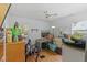 Bedroom with wood floors, ceiling fan and natural light from two windows at 1222 Palm St, Clearwater, FL 33755
