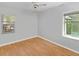 Neutral bedroom featuring wood floors and two windows for natural light at 1222 Palm St, Clearwater, FL 33755