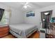 Bedroom features a queen bed, neutral colored walls, and natural light at 1222 Palm St, Clearwater, FL 33755