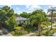 Charming single-story home with lush landscaping and mature trees in a serene setting at 1222 Palm St, Clearwater, FL 33755