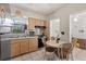 Cozy eat-in kitchen with tile floors, stainless steel refrigerator, and neutral cabinets at 1222 Palm St, Clearwater, FL 33755