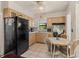 Bright eat-in kitchen featuring light wood cabinets and a view to the backyard at 1222 Palm St, Clearwater, FL 33755