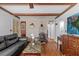 Open living room with hardwood floors, brick accent, and cozy fireplace at 1222 Palm St, Clearwater, FL 33755