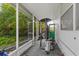 Spacious covered patio with punching bag and a view of the lush backyard at 1222 Palm St, Clearwater, FL 33755
