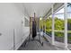 Covered patio featuring a punching bag, concrete floor, and a peek at the backyard at 1222 Palm St, Clearwater, FL 33755