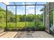 Enclosed patio with tile flooring, overlooking a lush green yard, perfect for enjoying outdoor living at 1222 Palm St, Clearwater, FL 33755