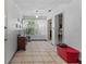 Bright sunroom with tile flooring, ceiling fan, and access to the backyard at 1222 Palm St, Clearwater, FL 33755