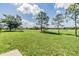 A view of the expansive backyard with golf course and pond at 12910 Prestwick Dr, Riverview, FL 33579