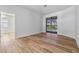 Bright bedroom with wood floors and sliding glass doors to the backyard at 12910 Prestwick Dr, Riverview, FL 33579
