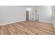 Bright bedroom with neutral walls, wood-look floors, and a closet providing comfortable living space at 12910 Prestwick Dr, Riverview, FL 33579
